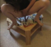 A woman takes a dump on a table. About 2 minutes.
